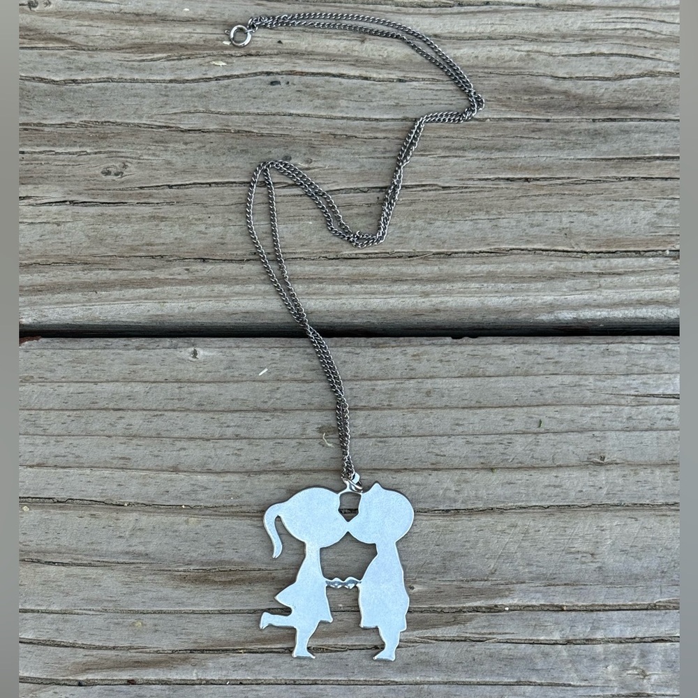 Bundle 3 for 50% off 1970s Deadstock Silver Tone Kissing Kids Pendant Necklace
